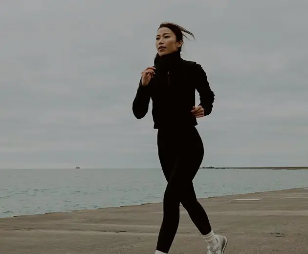 Patient running on a waterfront path