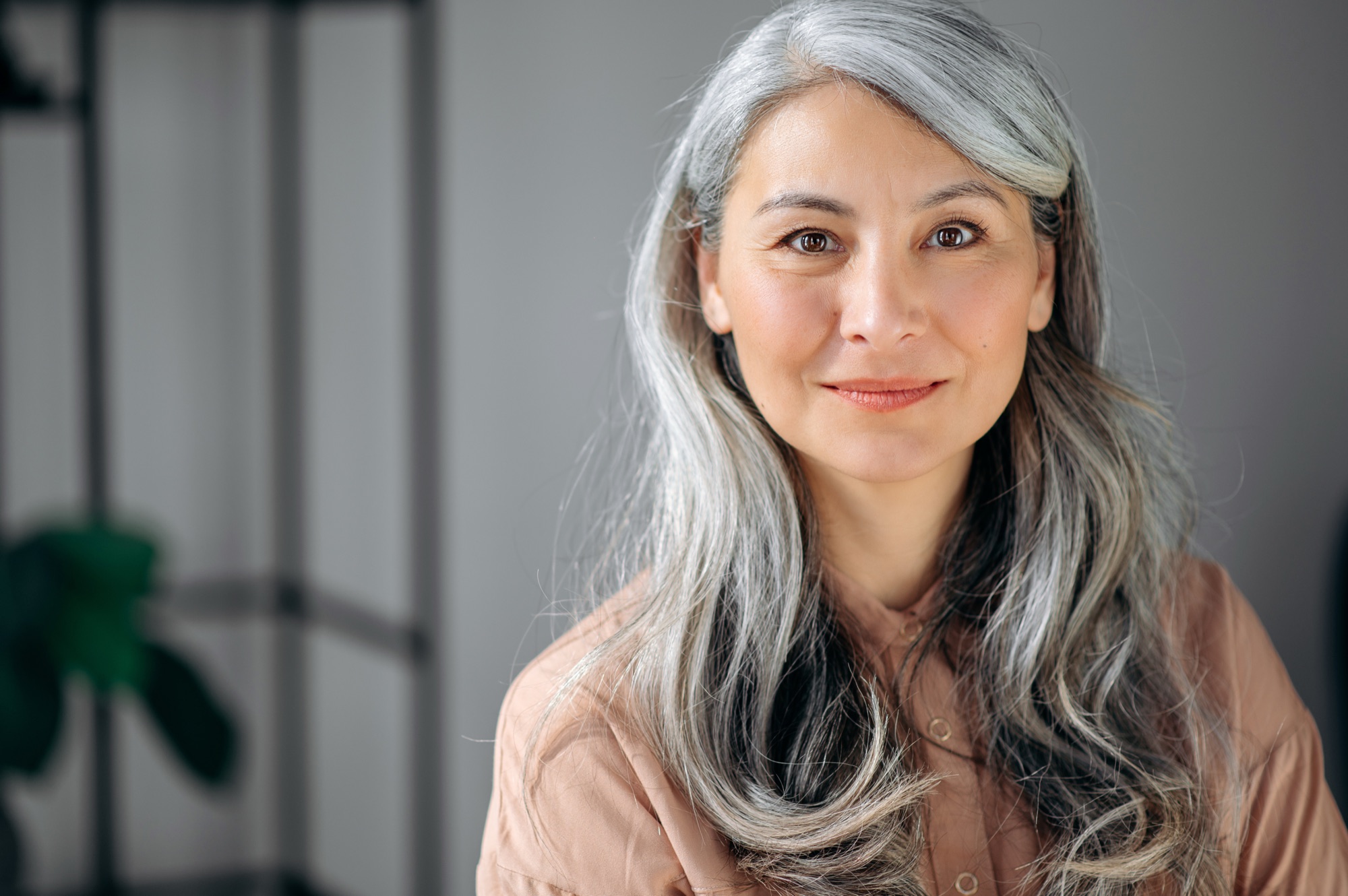 Portrait of a woman with silver hair, calm and composed